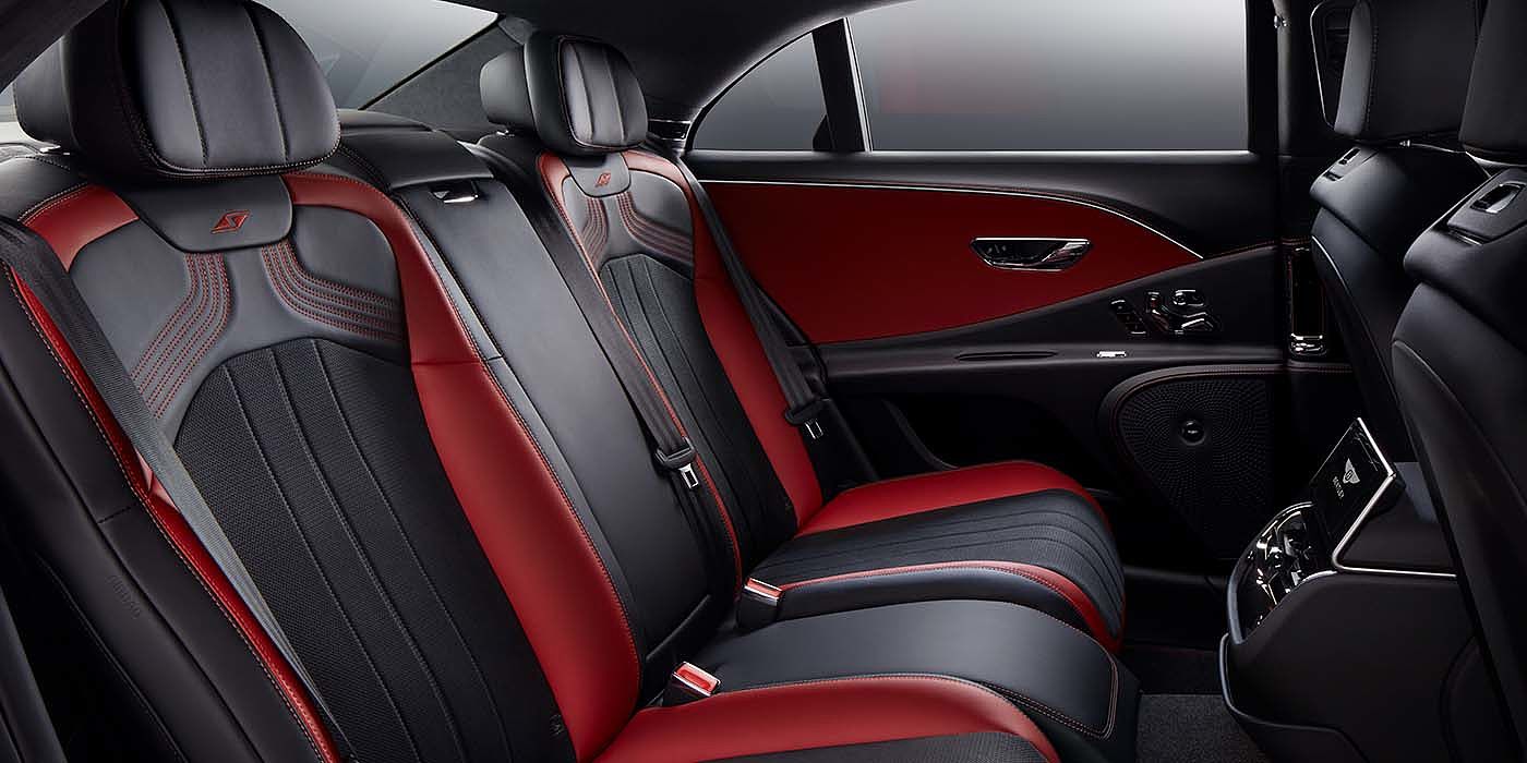 Bentley Istanbul Bentley Flying Spur S sedan rear interior in Beluga black and Hotspur red hide with S stitching