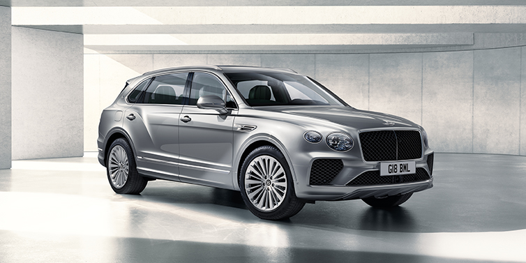 Bentley Istanbul Bentley Bentayga Extended Wheelbase SUV front three quarter in Moonbeam paint with a grey background